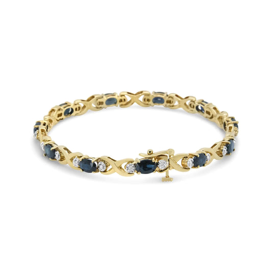 14K Yellow Gold 1 1/4 Cttw Round Diamond and 6x4mm Blue Sapphire "X" Link Bracelet (I-J Color, I1-I2 Clarity)- Size 7"